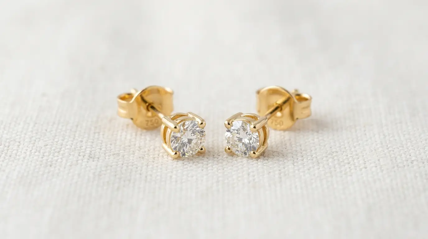 Золотые серьги с бриллиантами 750 пробы — пример оценки 128 000 тенге